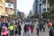Tourists walking in Nanjing Road, one of the world\'s busiest shopping streets.