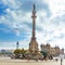 Tourists walking near Columbus monument in Barcelona, Spain