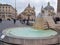 Tourists walking near the Fontana dell`Obelisco The Fountain with Lions, located in center of the Piazza del Popolo in Rome