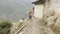 Tourists walking in nepalese village Prok, trek around mountain Manaslu, Nepal.