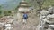 Tourists walking in nepalese village Prok, trek around mountain Manaslu, Nepal.