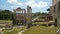 Tourists walking in open-air museum Roman Forum, view from Capitolium Hill