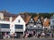 Tourists walking past cafes and the newcastle packet pub on sandside in scarborough in summer sunshine