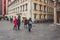 Tourists walking past the Falkenhaus on Market Place in Wurzburg, Germany