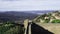 Tourists walking on the perimeter wall of the Fortress of Montalcino