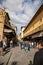 Tourists walking by The Ponte Vecchio in Florence
