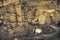 Tourists walking on stalactites cave looking infernal