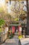 Tourists walking through the torii gates of Hanazono Inari Shrine in Ueno park.