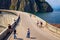 Tourists walking on Vidraru Dam on Lake Vidraru in Arges county