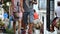 Tourists walking and watching people mounted on a donkey in a typical street of Mijas village in Andalusia