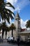 Tourists walks on sea promenade of old town Trogir