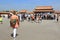 Tourists within the walls of the Forbidden Palace, Beijing, Chin