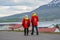 Tourists wandering around the streets of village of Hrisey in Iceland