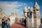 Tourists watch colorful chimneys on the roof of Casa Batllo