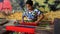 Tourists while watching the process of making woven cloth typical of the Sasak tribe of Lombok