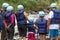 Tourists wearing helmet preparing for river tubing in Ecuador