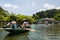 Tourists in wooden boats to travel Tam Coc