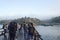 tourists on wooden Mon Bridge, Sangkhla Buri, Kanchanaburi, Thailand