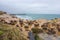 Tourists at the Yeliu Yehliu Geopark in Wanli District, New Taipei, Taiwan at a rainy, windy and overcast day.