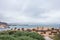 Tourists at the Yeliu Yehliu Geopark in Wanli District, New Taipei, Taiwan at a rainy, windy and overcast day.