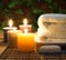 Towel, aromatic candles and other spa objects