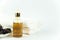 Towel with salt and bottle natural organic oil essence serum.