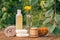 Towel, soap with marigold extract, calendula flowers in a flask with natural background