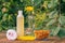 Towel, soap with marigold extract, calendula flowers in a flask with natural background