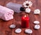 Towel, stones. Burning candle and oil. Spa concept