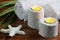 Towels with aromatic candles in wooden candlesticks, bamboo grass and starfish