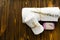 Towels, lavender soap, flowers on wooden table. spa treatment