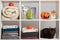 Towels, sheets, bed linen and a cat on the shelf. Textile storage and halloween celebration