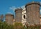 Tower of the ancient Angevin castle of Naples, in the background panoramic view of the Vesuvius volcano, Naples, Italy, september