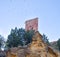 tower of a ancient castle in a small village called Villel in Teruel / Spain at the sunrise in the morning. Many doves flying