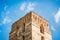 Tower of an ancient fortress against blue sky backgrounds_