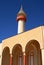 Tower and arcades detail on blue sky background