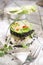 Tower of black and white rice with shrimp and zucchini