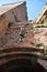 Tower in the blue sky, seen from one of the entrance doors, of Castelvecchio in Verona.