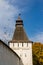 The tower of the Borovsky Monastery and a flying flock of pigeons. Pafnutyev-Borovsky Orthodox Monastery for Men