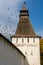 The tower of the Borovsky Monastery and a flying flock of pigeons. Pafnutyev-Borovsky Orthodox Monastery for Men