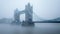 Tower Bridge in a foggy day, London, UK.