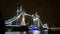 Tower Bridge in London wide night view of towers and thames river water reflection, London