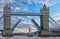 Tower Bridge opens to allow a tall ship to pass through