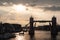 Tower bridge with skyline London, United Kingdom. Bridge over Thames river on cloudy sky. City buildings on river banks