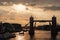 Tower bridge with skyline London, United Kingdom. Bridge over Thames river on cloudy sky. City buildings on river banks