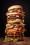 Tower of burgers on dark background