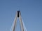 The tower and cables on the marine way suspension bridge in southport merseyside against a blue summer sky