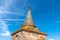 Tower of the Cathedral of Evora. Low angle view against blue sky