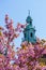 Tower of the Cathedral of Wawel with pink blossoms.