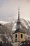 Tower of the church of Chamonix village in winter, France.